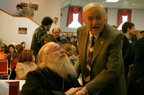 Sign with parishioner 2.png