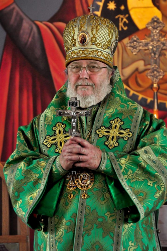 His eminence irenee hold cross of blessing after liturgy 1.png