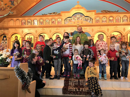 Father Lucian and children 2.png