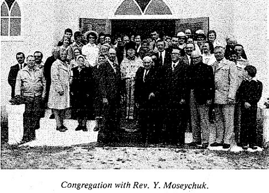 Sandy Lake parishioners with Father Moseychuk 1.png
